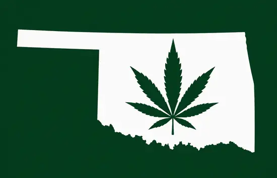White silhouette of Oklahoma on a dark green background, with a dark green cannabis leaf centered inside the state outline.